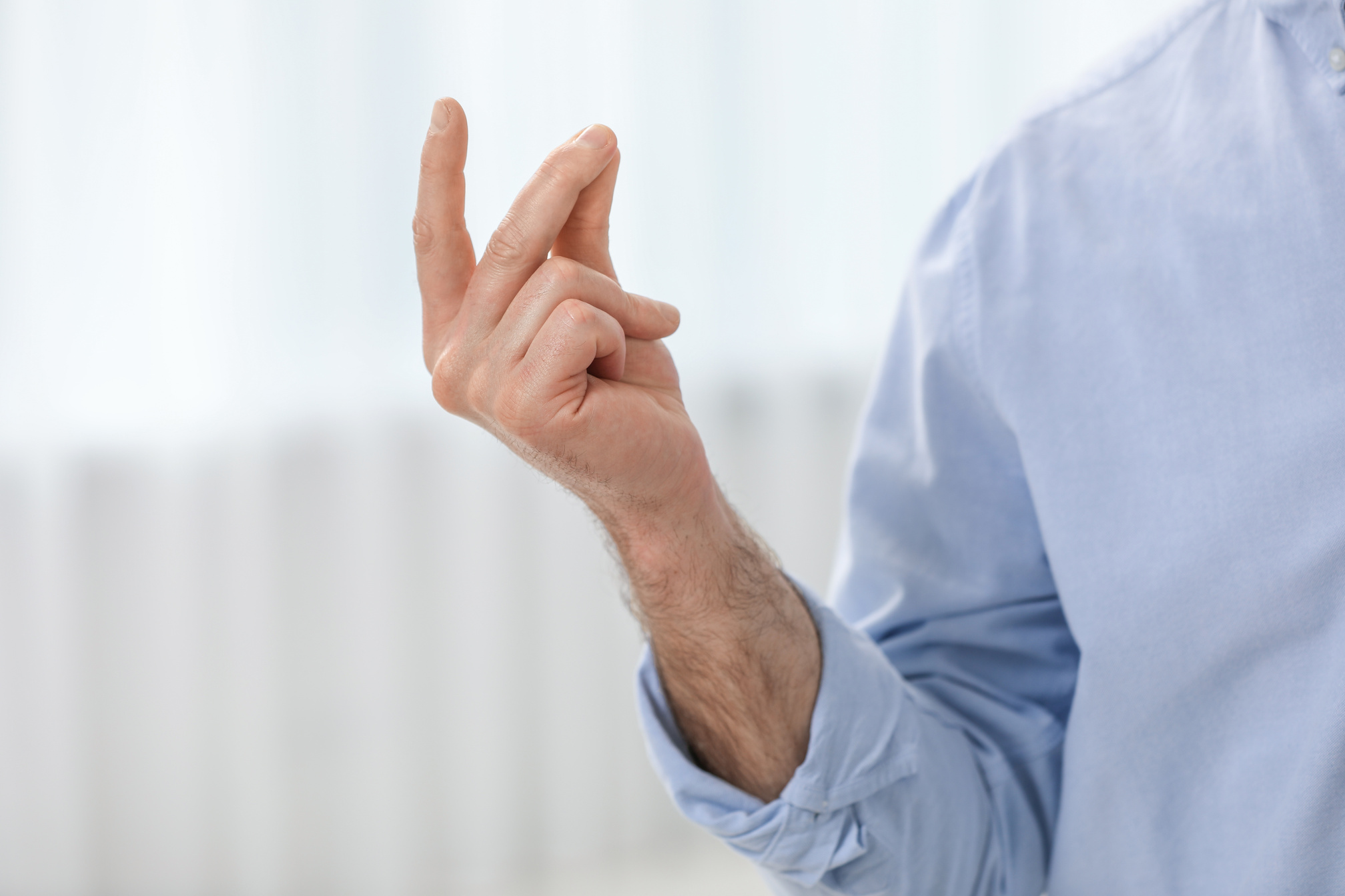 Man Snapping His Fingers Indoors, Closeup. Bad Habit